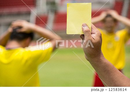 Referee soccer show card for warning and  recorded player foul 12583614