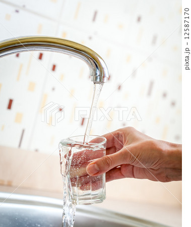 Water poured from tap to glass Water poured from tap to glass 12587170