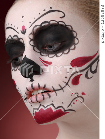 Woman with dia de los muertos makeup 12592933