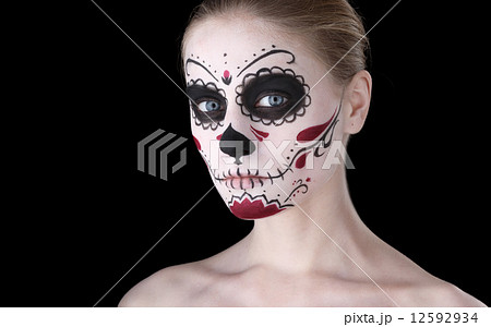 Woman with dia de los muertos makeup, black empty space. 12592934