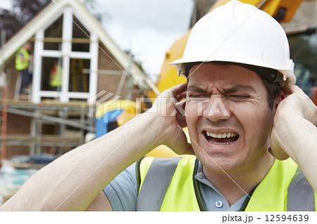 Construction Suffering From Noise Pollution On Building Site 12594639