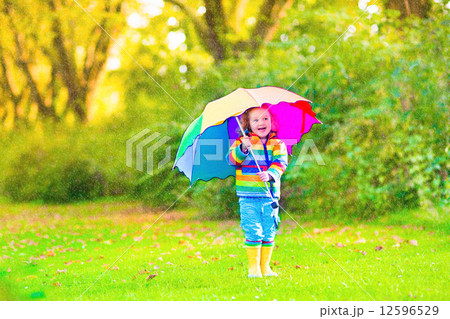 Little girl with umbrella Little girl with umbrella 12596529