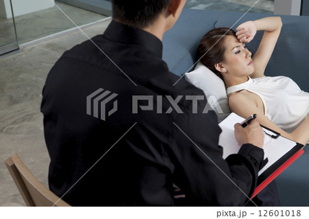 Depressed patient lying on couch 12601018