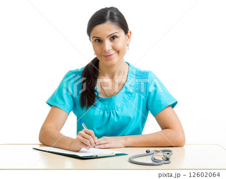 cheerful female physician with clipboard 12602064