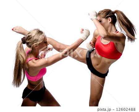 Two attractive athletic girls fighting over white background 12602488