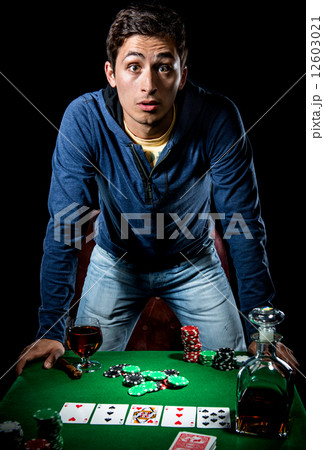 Young gambler indoors Young gambler indoors 12603021