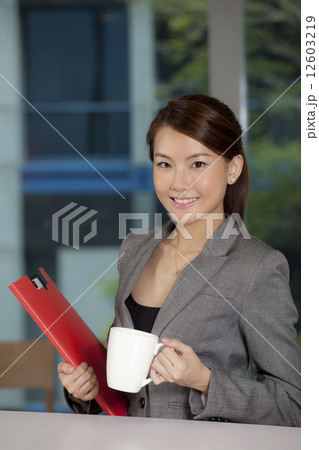Asian businesswoman taking a break Asian businesswoman taking a break 12603219