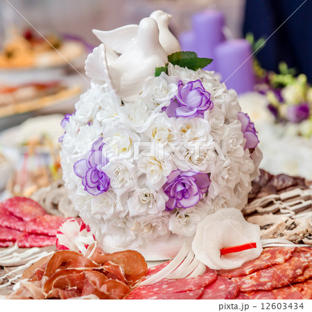 Beautiful bouquet and various delicious meat appetizers 12603434