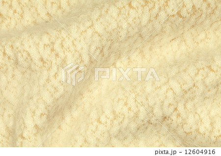 Light yellow crumpled luxury cashmere background. 12604916