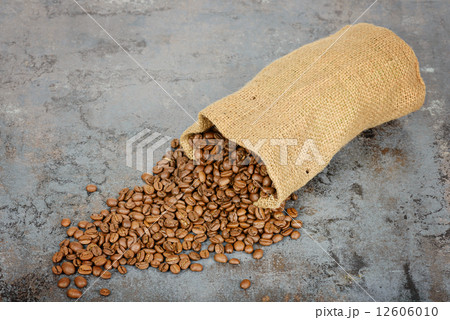 Coffee beans spilled out of the sack 12606010