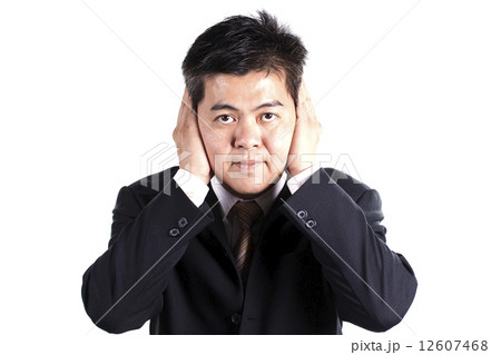 Businessman hold hands cover his ears Businessman hold hands cover his ears 12607468