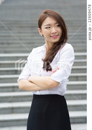 one young successful chinese office lady in front of steps outdoor one young successful chinese office lady in front of steps outdoor 12609478