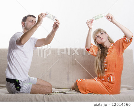 Young boy and girl define fake whether banknotes 12614560