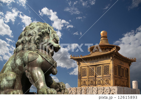 Bronze Guardian Lion Statue and bronze pagoda in the Forbidden City, Beijing, China Bronze Guardian Lion Statue and bronze pagoda in the Forbidden City, Beijing, China 12615893