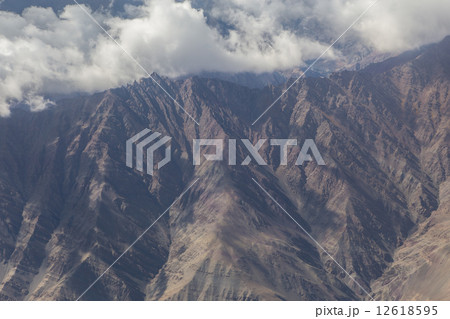 Himalaya mountains under clouds Himalaya mountains under clouds 12618595