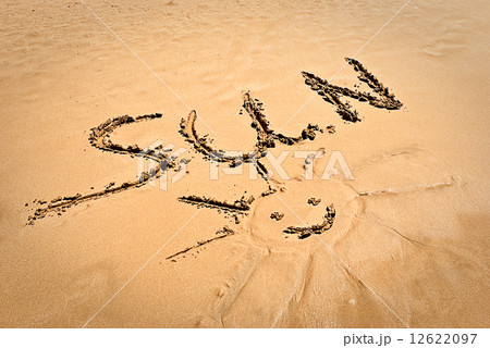 concept photo of smiling sun with discription "SUN" on the beach sand concept photo of smiling sun with discription "SUN" on the beach sand 12622097