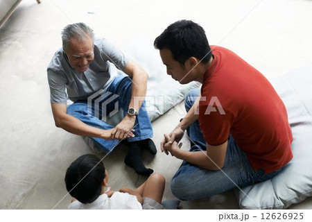 Three Generations of Men - Sitting on Floor 12626925