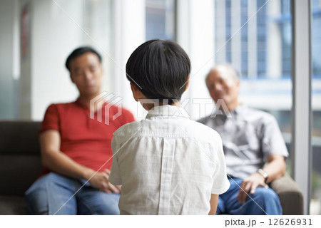 Three Generations of Men - Sitting on Couch 12626931