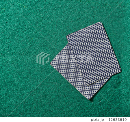 cards on the green poker table 12628610
