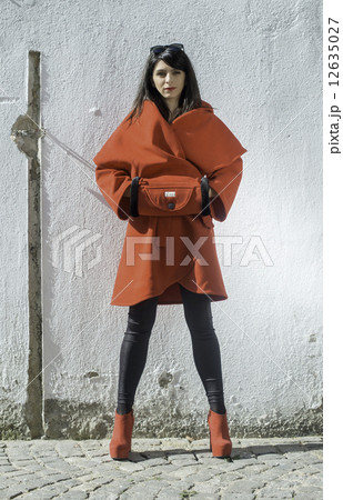 Women in wool jacket on a street Women in wool jacket on a street 12635027