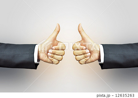 Two hands of businessman giving thumbs up 12635263