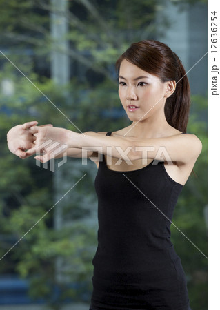 Fit Asian girl stretching Fit Asian girl stretching 12636254