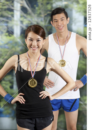 Fit Asian couple with sports medals Fit Asian couple with sports medals 12637326