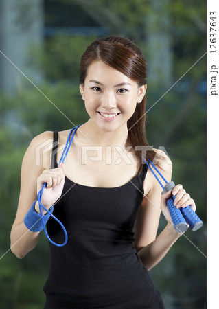 Fit Asian woman with skip rope Fit Asian woman with skip rope 12637643