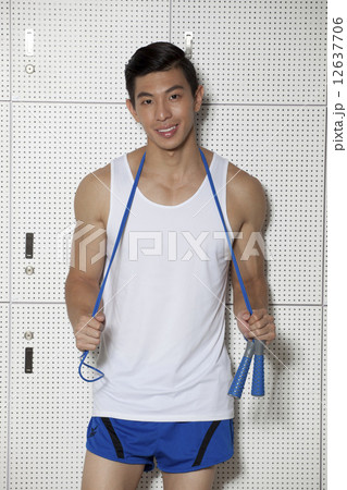 Fit Asian man with skip rope 12637706