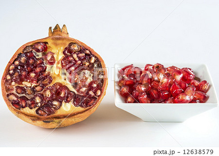 Pomegranate seeds and half fruit Pomegranate seeds and half fruit 12638579