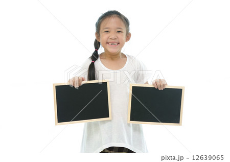 Little asian girl holding two black boards on white background 12639065