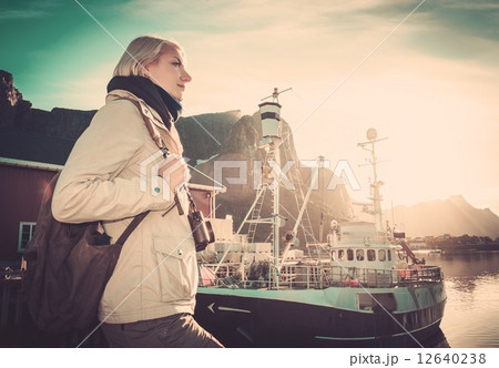 Woman traveler in Reine village, Norway 12640238