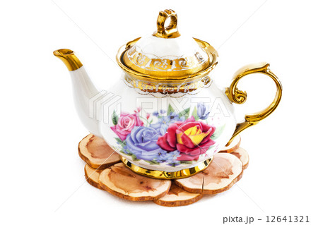 Ceramic teapot on Wooden stand . Ceramic teapot on Wooden stand . 12641321