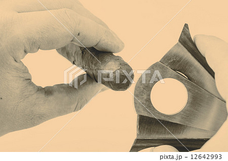 Cigar and cutter on a white background Cigar and cutter on a white background 12642993