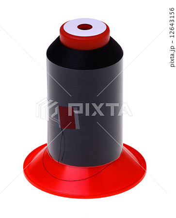 Bobbin of black tread, isolated over white 12643156