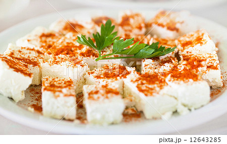 Original bulgarian cheese into plate with parsley and red hot pe Original bulgarian cheese into plate with parsley and red hot pe 12643285