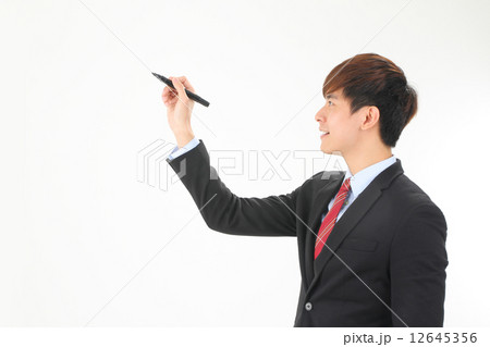 Male asian executive writing with black marker 12645356
