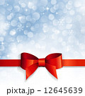 red bow on a background snowflakes 12645639