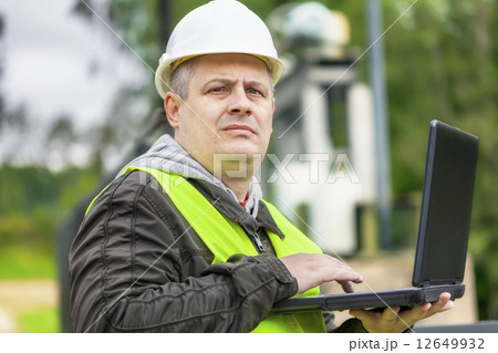 Engineer with PC at outdoor  12649932