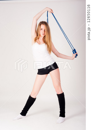 fitness woman with jumping rope 12650116