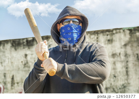 Man with a baseball bat at outdoor  12650377