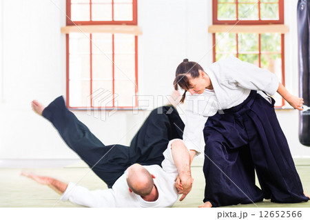 Man and woman fighting at Aikido martial arts school 12652566