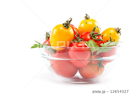 Tomatoes in a glass on a white background. Tomatoes in a glass on a white background. 12654327
