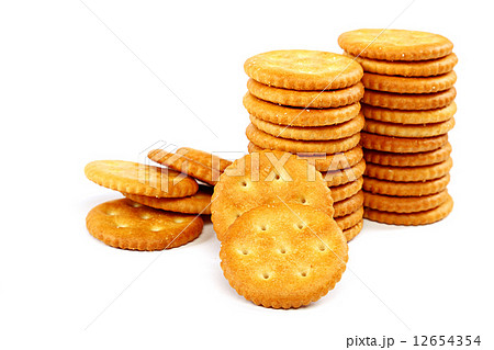 Stack of cracker biscuits on a white background. Stack of cracker biscuits on a white background. 12654354
