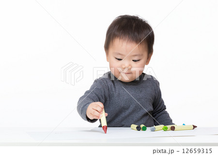 Asian baby boy concentrate on drawing 12659315