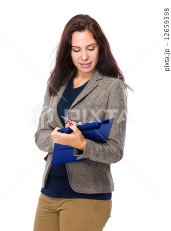 Brunette woman wite on clipboard 12659398