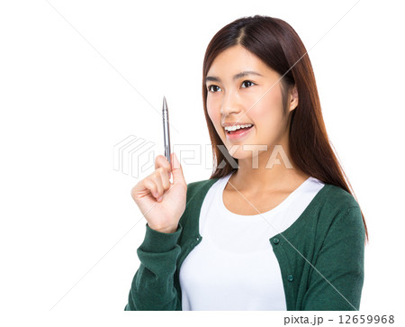 Woman think of idea with pen Woman think of idea with pen 12659968