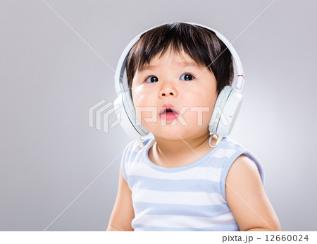 Baby boy wearing headphone Baby boy wearing headphone 12660024