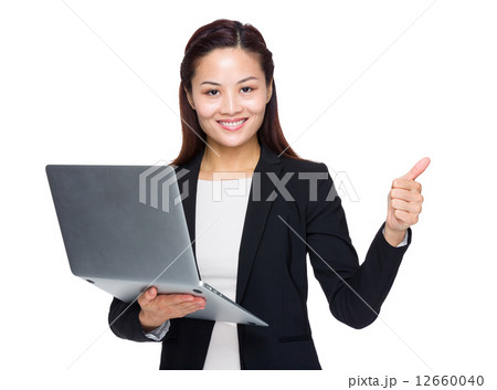 Businesswoman with laptop and thumb up Businesswoman with laptop and thumb up 12660040