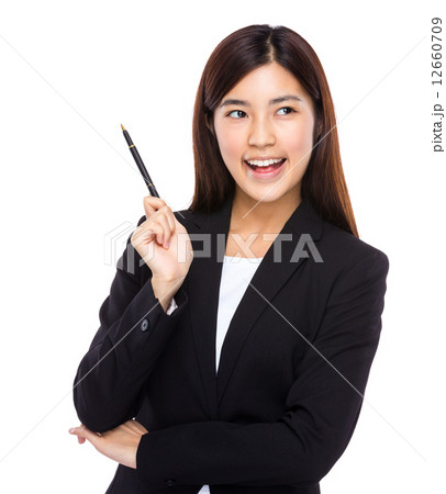 Asian businesswoman hold pen with idea Asian businesswoman hold pen with idea 12660709